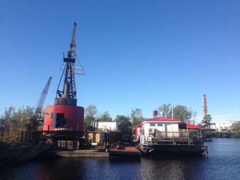 Anne Bonny’s barge restaurant was seen pulled upriver by a tugboat Monday afternoon from its location near Dock and Front Street downtown Wilmington, eventually finding its winter hideaway at Smith Creek Boatyard, pictured. (Port City Daily photo/Mark Darrough)