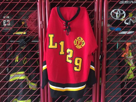 The Wilmington Fire Department will attempt to steal the trophy from the Wilmington Police Department – and break an all-time series tie of 3-3. Pictured, a WFD jersey hangs on a locker at WFD's Station 3 on New Cinema Drive. (Port City Daily photo/Mark Darrough)