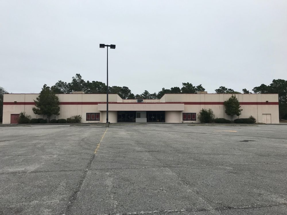 The former Carmike Cinema on Oleander Drive has been dilapidated for years; a new proposal would redevelop it into a mixed-use project. (Port City Daily photo / Benjamin Schachtman)
