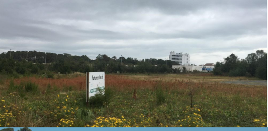 Top: The vacant property in Carolina Beach which is to be the site for a new Harris Teeter. Bottom: The construction work on the new Publix, which is proceeding at a rapid pace. (Port City Daily photo / Staff photos)