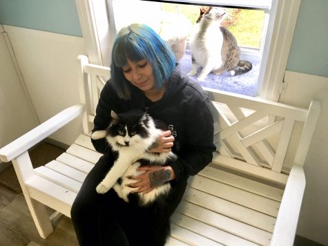 Buddy enjoys his cuddle time with animal care specialist Janet Arias. (Port City Daily photo / Samira Davis)
