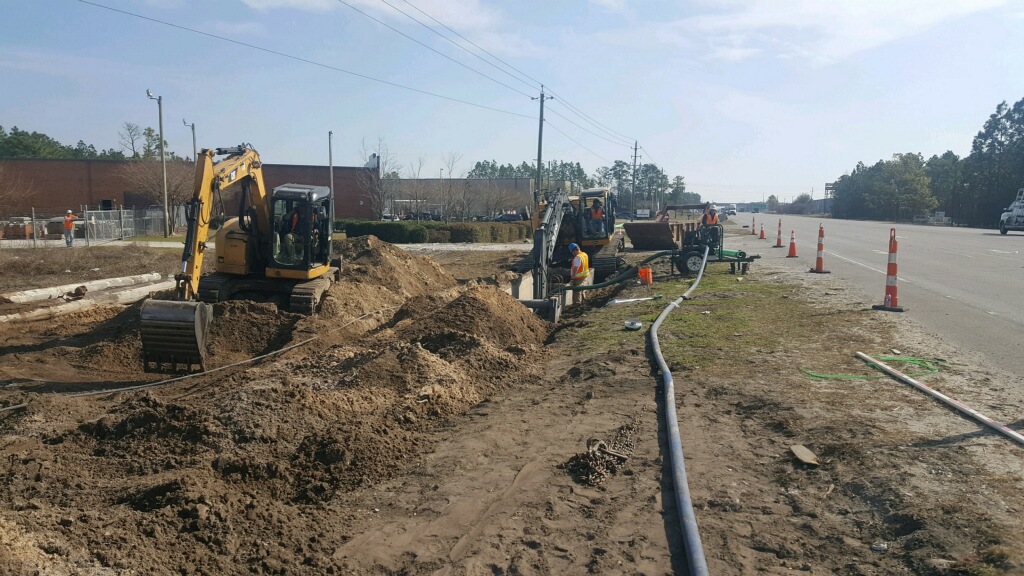 Installation of new water and sewer lines along Highway 421. (Port City Daily photo / Cape Fear Public Utility Authority)