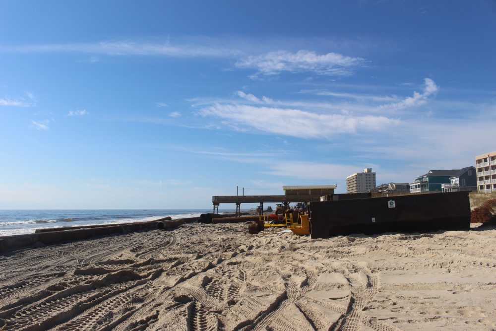 The beach nourishment project is making its way from Carolina Beach towards Kure Beach (Port City Daily/Michael Praats)