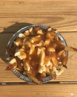 A plate of poutine at Spudee's. A Quebec dish, poutine is made of fries and cheese kurds topped with brown gravy. (Port City Daily photo/Courtesy Spudee's)