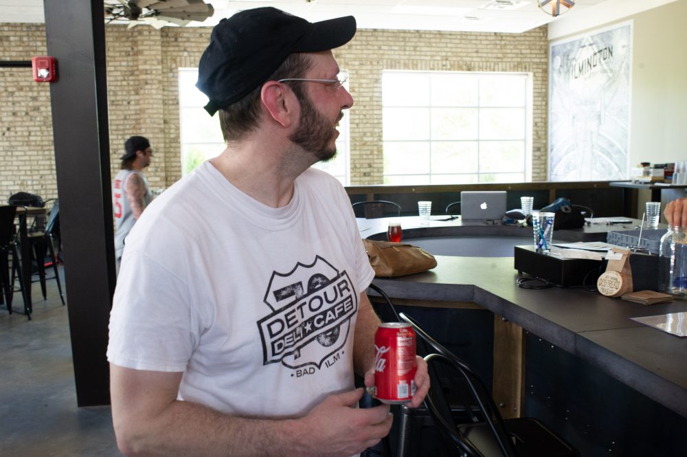 Detour Deli & Cafe owner Al Snyder takes a coke break inside Flying Machine Brewing Company. (Port City Daily photo/Mark Darrough)