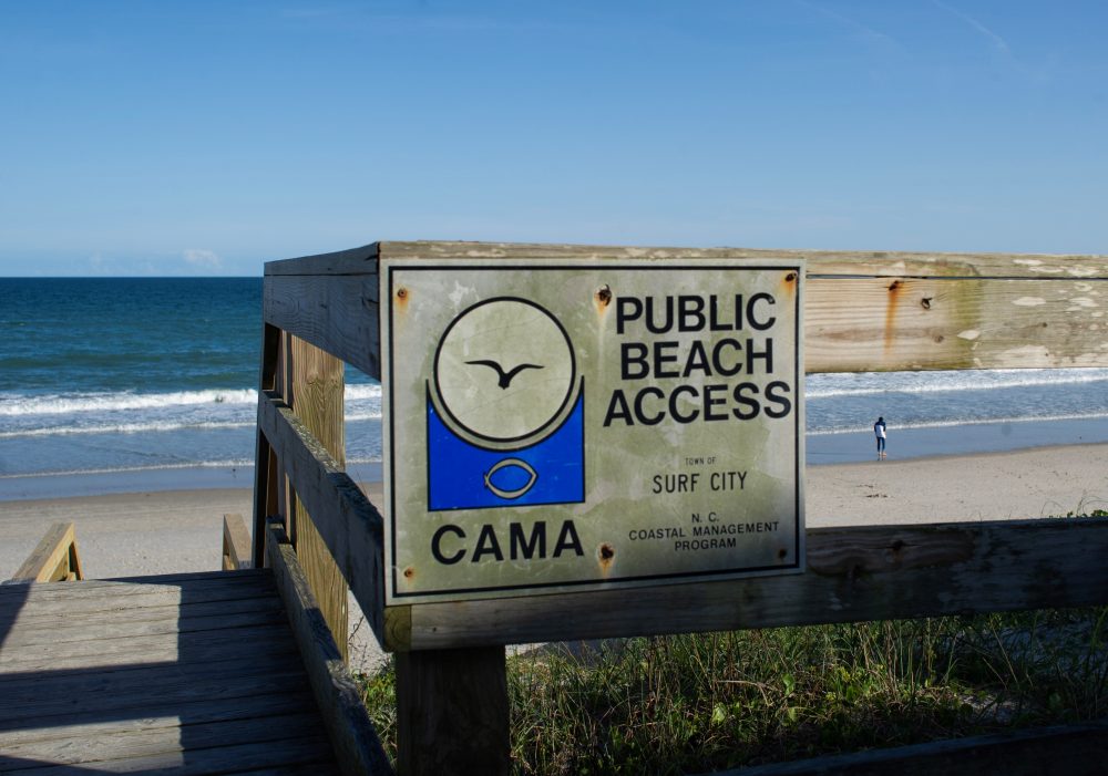 Town Manager Ashley Loftis said that CAMA regulations allowed for up to 5 percent of sediment in the sand. She said only .004 percent has been discovered after the stop-order was issued. (Port City Daily photo/Mark Darrough)