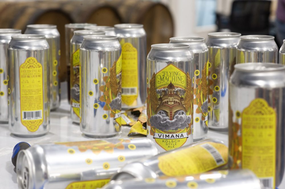 Cans of the Vimana Kolsch after a test run of the brewery's new canning line. (Port City Daily photo/Mark Darrough)