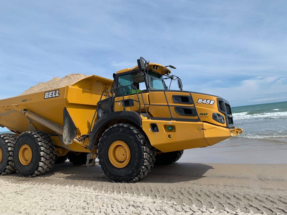 A sand-hauler drives on the Surf City beach in March. (Port City Daily photo/Courtesy Vicki Bozzola)