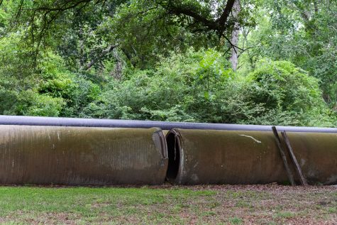 Damaged portions of the 48-inch water main, which leaked in October 2016 during Hurricane Florence, are stored outside LCFWASA's Kings Bluff property. The 20-foot main sections are so heavy they had to be removed by a crane, a factor that made fixing the leak more difficult, according to the authority's director. (Port City Daily photo/Johanna Ferebee)