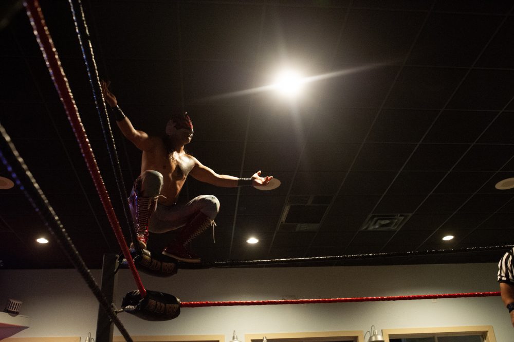 Sky Bird stares down his opponent Minnue Fusion before making a leap onto the ring. (Port City Daily photo/Mark Darrough)