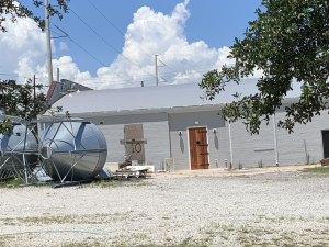 The brewery's parking lot sits empty except for some brewing equipment (Port City Daily/Michael Praats)