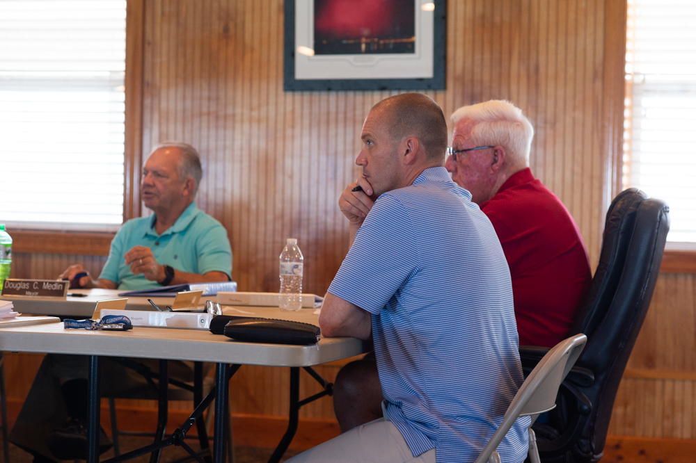 Surf City Councilman Jeremy Shugarts, who is challenging Mayor Doug Medlin for his seat in November, at a special meeting Thursday afternoon. Medlin is pictured at left. (Port City Daily photo/Mark Darrough)