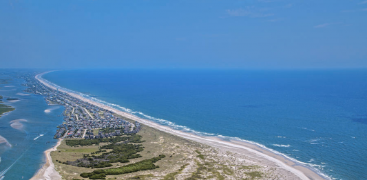 More than 100 acres of open land on Topsail Island, which has slowly built up sand coming from the north end over the years, has been listed for sale at $7.9 million. This aerial image was taken by photographer Betsy Knapp in 2016. (Port City Daily photo/Courtesy Betsy C. Knapp)