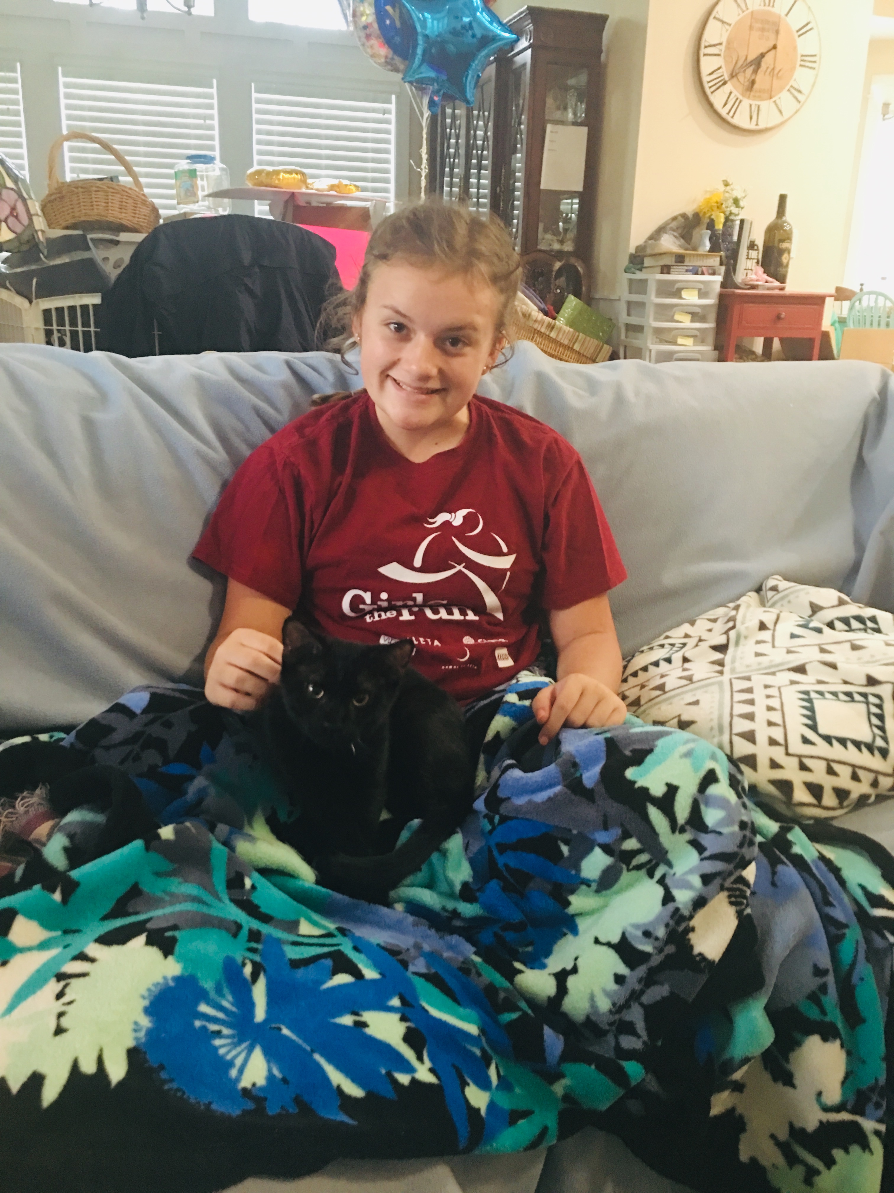 Reese Priddle, 13, cuddles Sparky. (Port City Daily photo / Samira Davis)