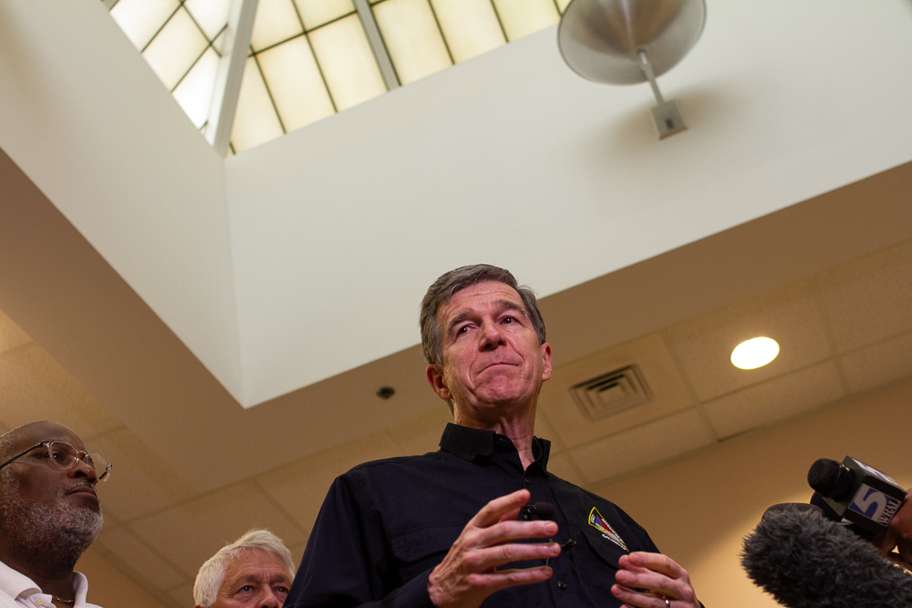 Governor Roy Cooper addresses the press in the New Hanover County Emergency Operations Center Tuesday morning to prepare for Hurricane Dorian, accompanied by (right) New Hanover County Chairman Jonathan Barfield. (Port City Daily photo/Johanna Ferebee)