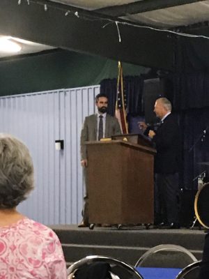 Mayor Doug Medlin, right, introduces Assistant District Attorney Conor Degnan at his campaign dinner last Saturday. (Port City Daily photo/File)