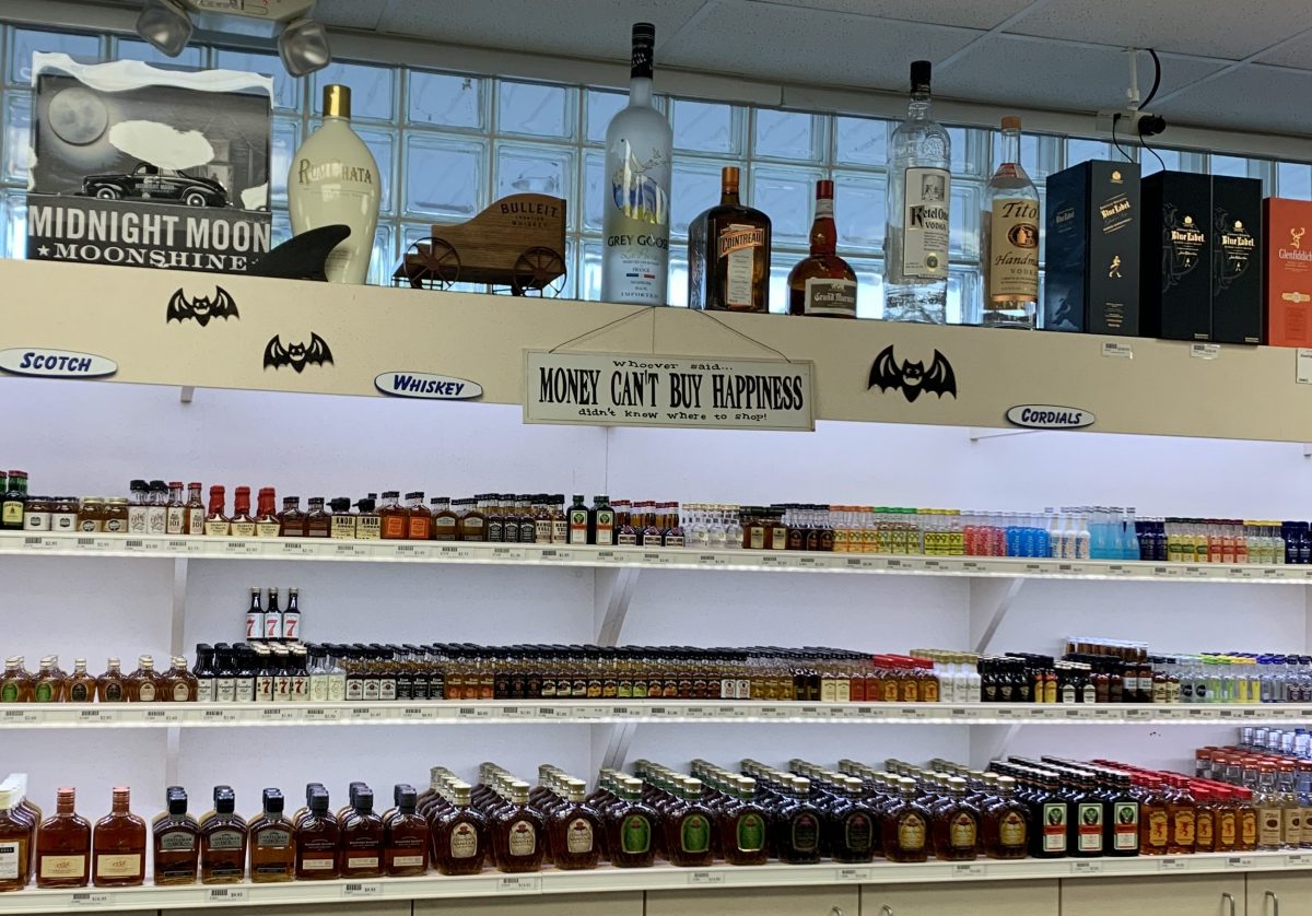 "Whoever said money can't buy happiness didn't know where to shop." reads a sign posted in the Wrightsville Beach ABC store in New Hanover County. (Port City Daily photo / File)