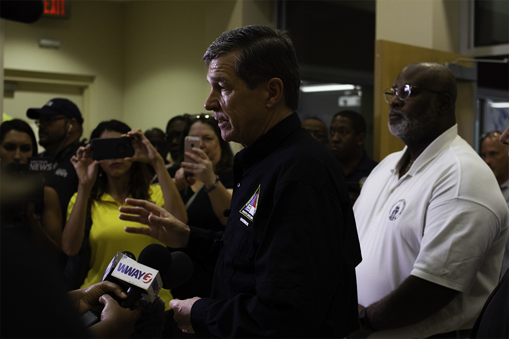 (Left) Governor Roy Cooper prepares to address the press in the New Hanover County Emergency Operations Center Tuesday morning to prepare for Hurricane Dorian, accompanied by (right) New Hanover County Chairman Jonathan Barfield. (Port City Daily photo/Johanna Ferebee)