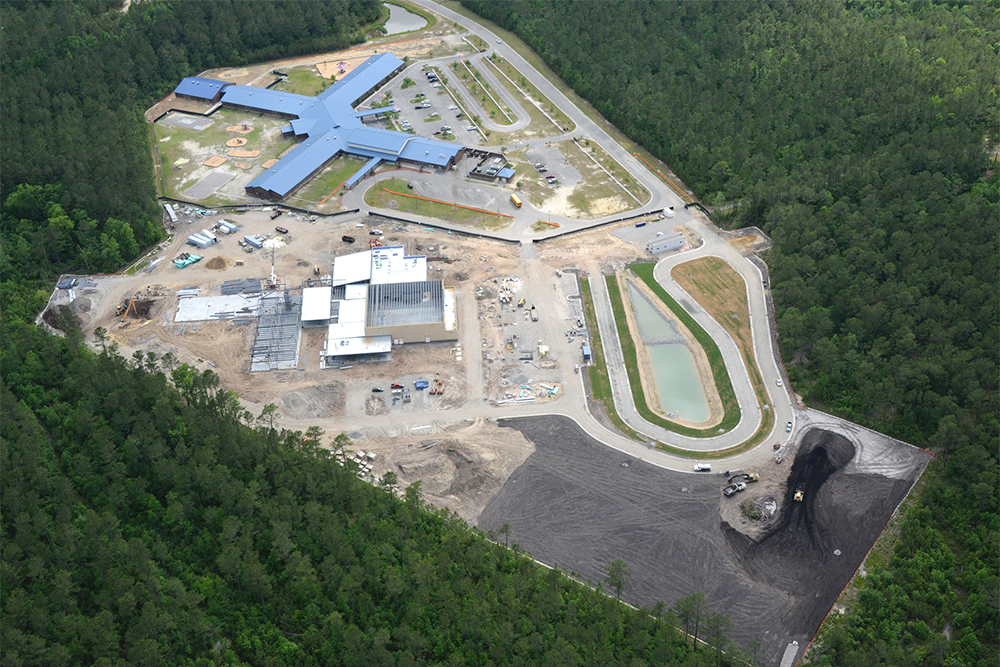 Work continues on Town Creek Middle School, next to Town Creek Elementary School, in Winnabow. A school reassignment decision to accommodate the new middle school could be finalized as early as December. (Port City Daily photo/Courtesy Brunswick County Schools)