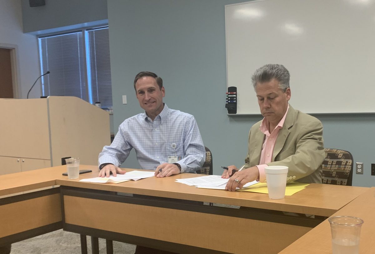 New Hanover Regional Medical Center President and CEO John Gizdic (left) and New Hanover County Manager Chris Coudriet (right) during a press briefing on Friday.(Port City Daily photo / Benjamin Schachtman)