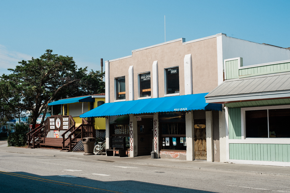 Red Dogs (located on the second floor above the blue awning), has faced resistance from the Town of Wrightsville Beach for decades (Port City Daily/Mark Darrough)