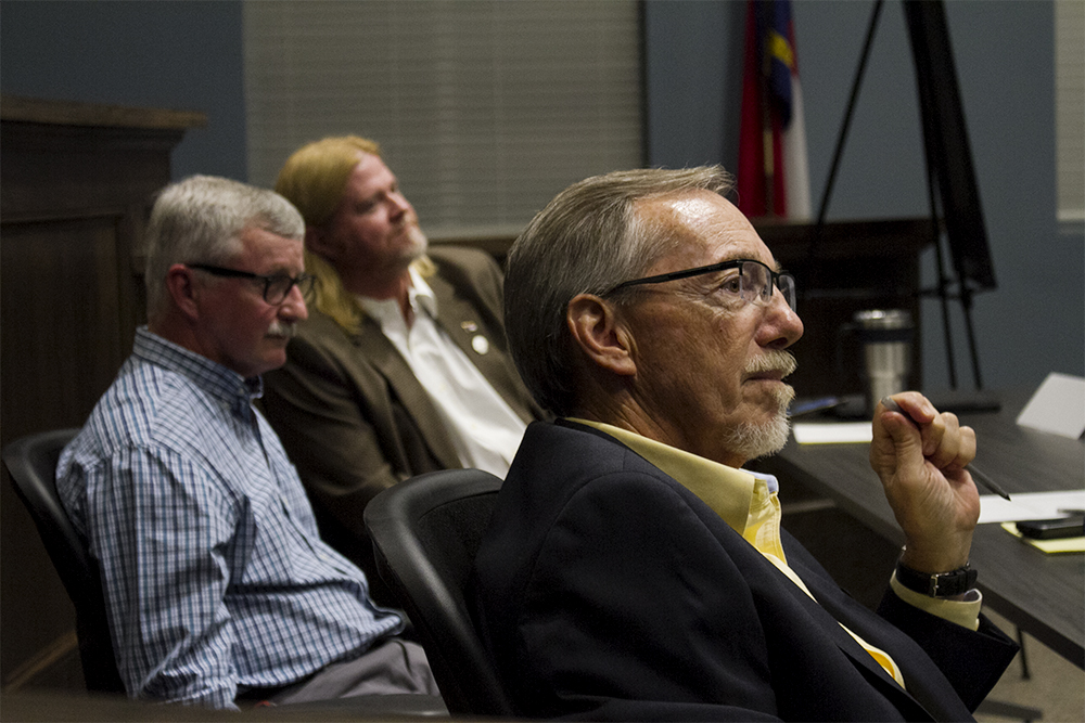 (Left) Kure Beach Mayor Pro Tem David Heglar, (center) Councilman Joseph Whitley, and Mayor Craig Bloszinsky listen to audience questions at the Pleasure Island Chamber of Commerce's political forum Thursday. (Port City Daily photo/Johanna Ferebee)