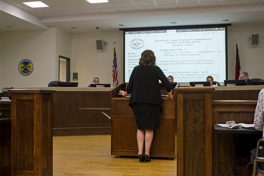 Board of Elections Director Sara Knotts presents her board's split recommendation to purchase new voting equipment, which the Brunswick County Board of Commissioners approved with a split vote. (Port City Daily photo/Johanna Ferebee)