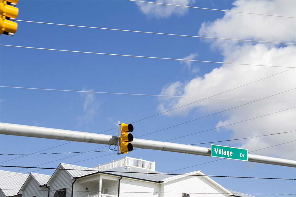 Leland is exploring the possibility of burying overhead utilities along Village Road, currently an unfunded and costly project. (Port City Daily photo/Johanna Ferebee)