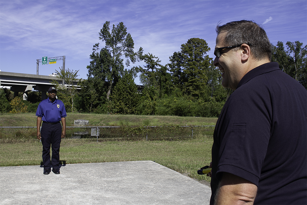 Assistant Chief acts as a detainee while Lt. Kevin Johnson deploys the non-lethal BolaWrap at a Wilmington Police Department demonstration Wednesday. (Port City Daily photo/Johanna Ferebee)