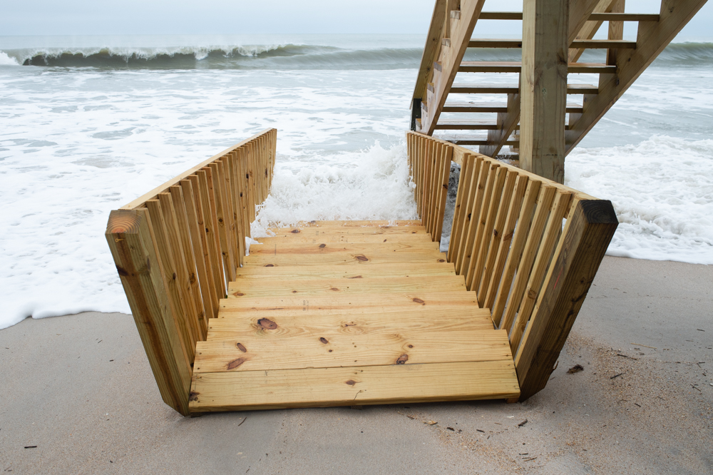 <!-- wp:paragraph --> <p>Just before noon Monday, the storm was still pushing in a severe high tide. Sue Andrews lives in an oceanfront home along the 1400 block of North Shore Drive, where several of the dune breaches occurred.</p> <!-- /wp:paragraph -->  <!-- wp:paragraph --> <p>"We lost all of the new sand berm that the town built in March," Andrews said. "Saturday we lost half of it, and by early Sunday afternoon, it was all gone."</p> <!-- /wp:paragraph -->