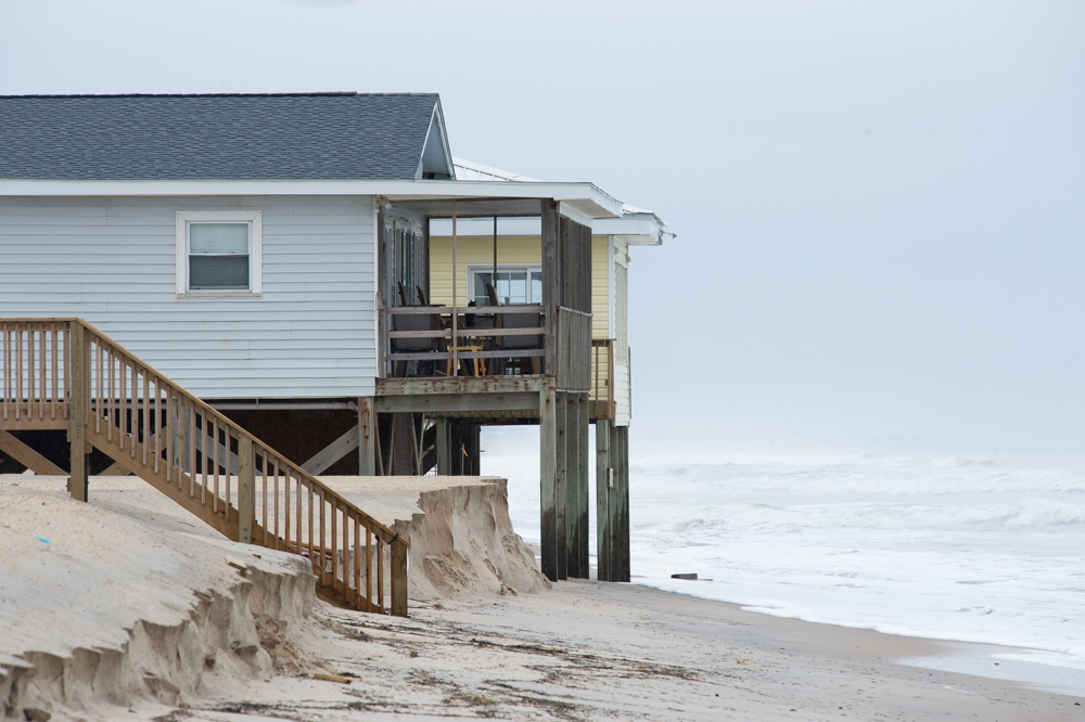 Sand-hauling work was scheduled to begin Monday, but is delayed until beach engineers assess the damages from the storm. Here, a sand pile recently dumped just south of the Surf City Pier. (Port City Daily photo/Mark Darrough)