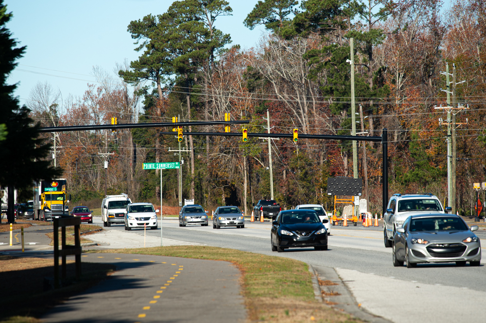 A new traffic light is currently running an obligatory phase of constant blinking yellow lights before the store's Wednesday opening. (Port City Daily photo/Mark Darrough)