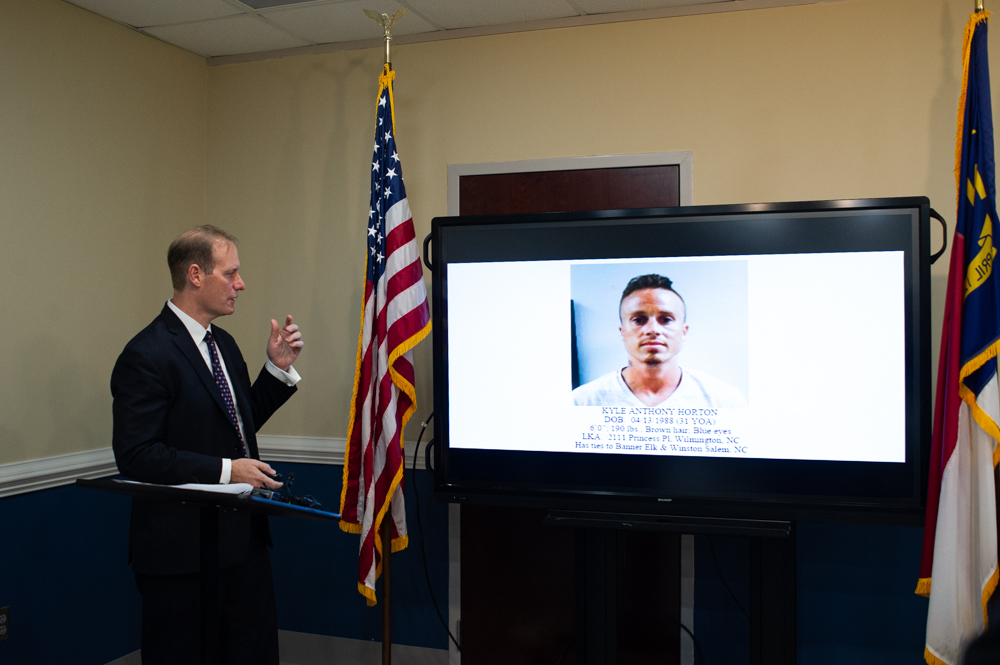 District Attorney Ben David discusses the investigation of the shooting death of Kyle Horton, pictured at right. (Port City Daily photo/Mark Darrough)