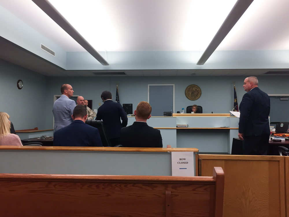 Surf City Councilman Jeremy Shugarts, left, looks at prosecutor Chuck Spahos, right, at Pender County Superior Court on Friday morning. (Port City Daily photo/Mark Darrough)