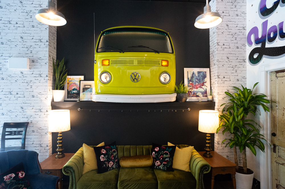 Owners Artie and Robin Hill found an old VW bus in Robin's hometown of Anderson, South Carolina and had the front cut off and put on a trailer, where it now hangs above the new taproom's lounge area. (Port City Daily