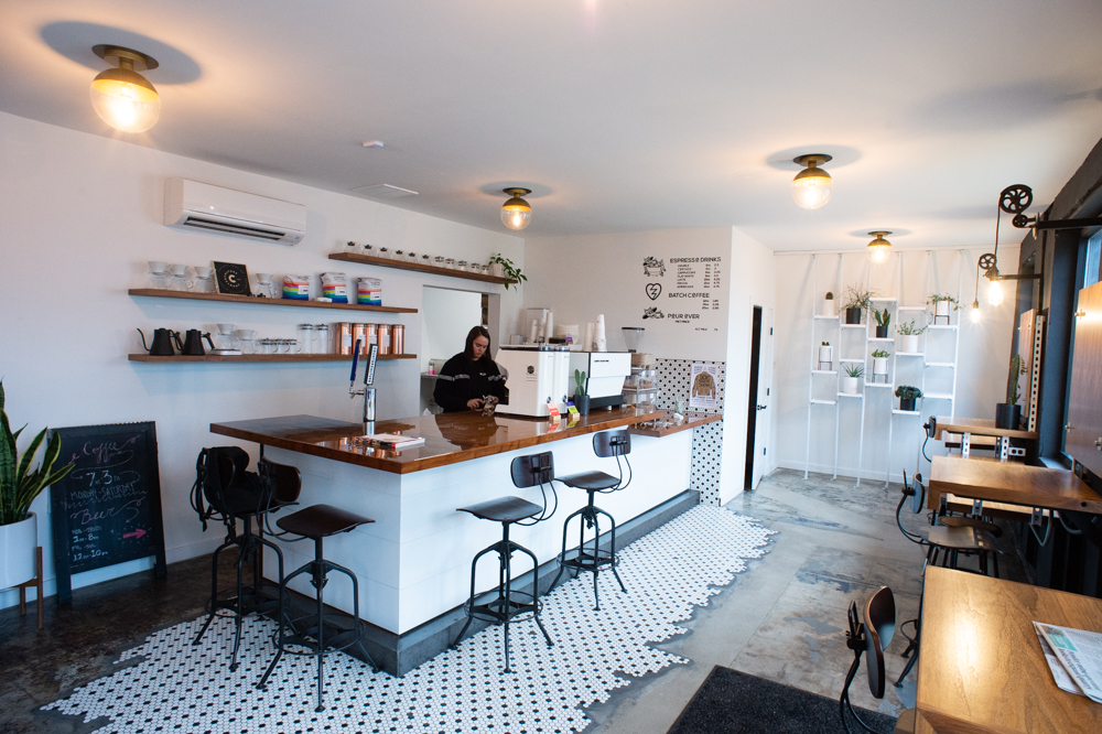 On the east end of the Quonset hut is the second location of Bespoke Coffee and Dry Goods, set up for customers to get work done before going to the back bar in the afternoon and evening. (Port City Daily photo/Mark Darrough)