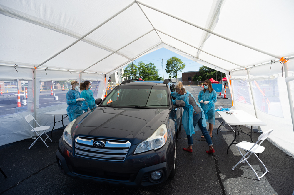 Public health nurse Tammy Dilling shows how she will administer a nasal swab to New Hanover County residents reporting symptoms of Covid-19. (Port City Daily photo/Mark Darrough)