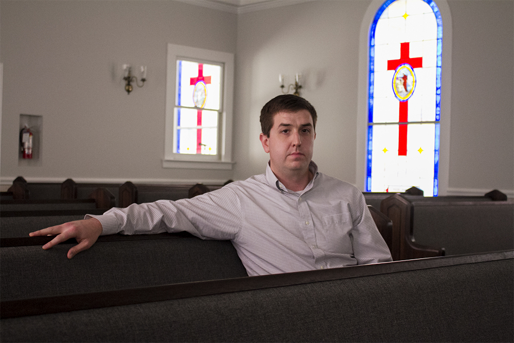 Pastor Tyler Daniels pictured in the pews of Zion United Methodist Church in Leland. (Port City Daily photo/Johanna F. Still)