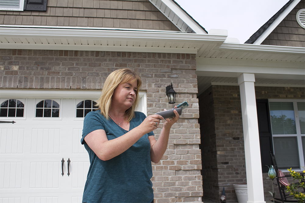 Courtney Younghans triple-tasks. On a conference call for work, Younghans juggles homeschool and home life with her three sons in Leland. (Port City Daily photo/Johanna F. Still)