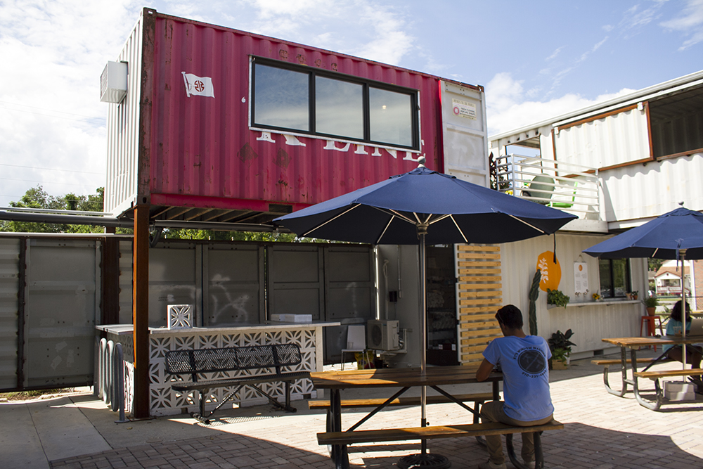 Petals To The People has moved into a red, second-story shipping container in the Cargo District's new Outpost incubator hub. (Port City Daily photo/Johanna F. Still)