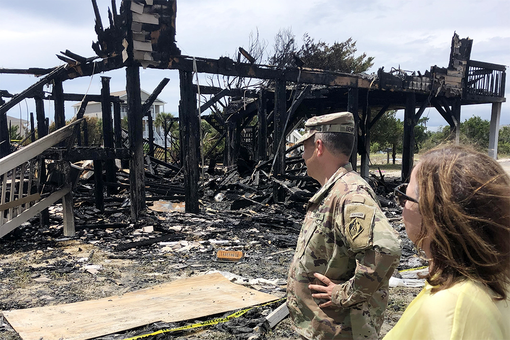 Wilmington District Commander Col. Ben Bennett surveys fire damage alongside Ocean Isle Beach Mayor Debbie Smith after Hurricane Isaias made landfall in the town earlier this month. (Port City Daily photo/Courtesy USACE) 