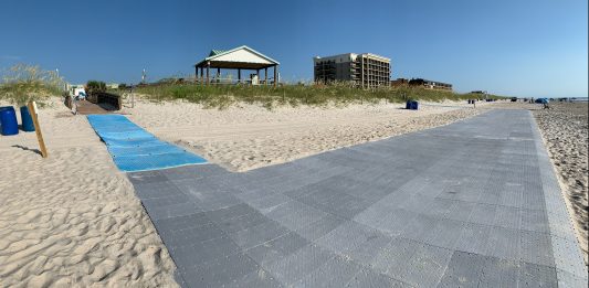The state notified the nonprofit Ocean Cure that it must remove its wheelchair beach access matte because it threatened sea turtles and shorebirds. (Port City Daily photo/Courtesy Kevin Murphy)