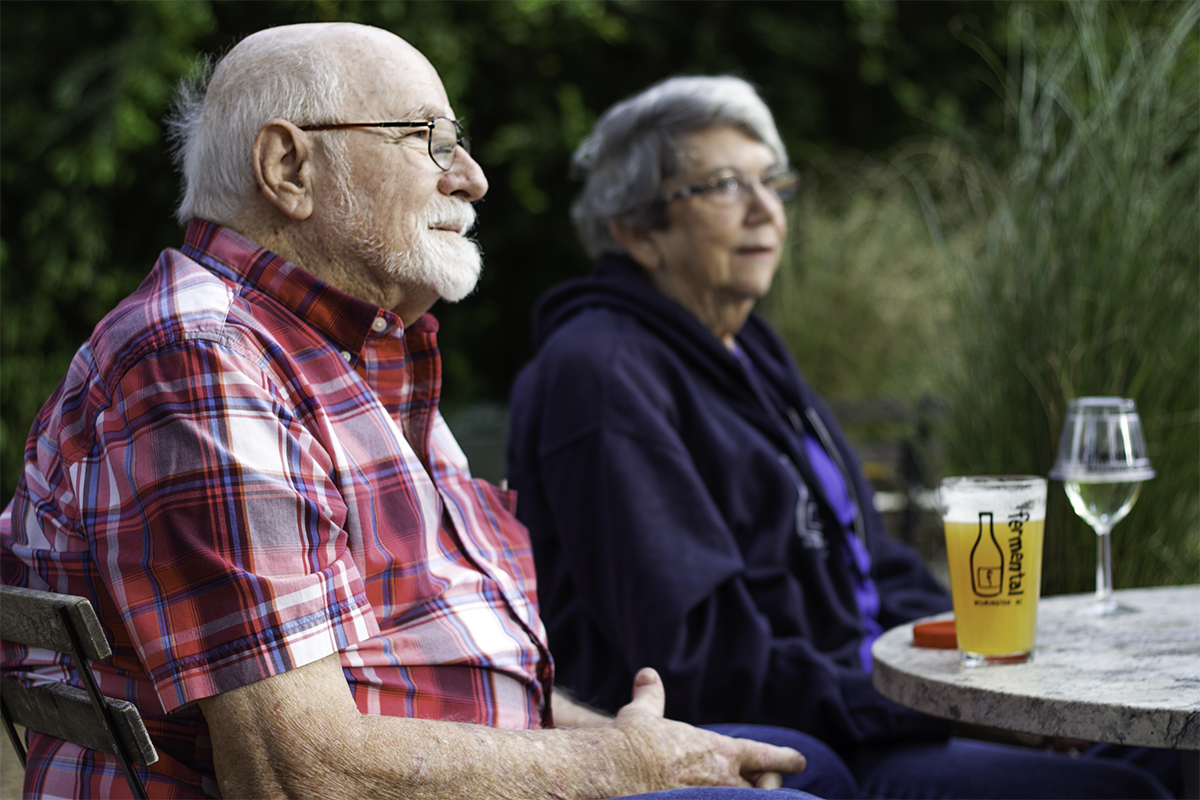 Fermental regulars Allan and Yvonne Nance visit with friends at he Ogden neighborhood bottle shop, where they stop by a few times a week. (Port City Daily photo/Johanna F. Still)