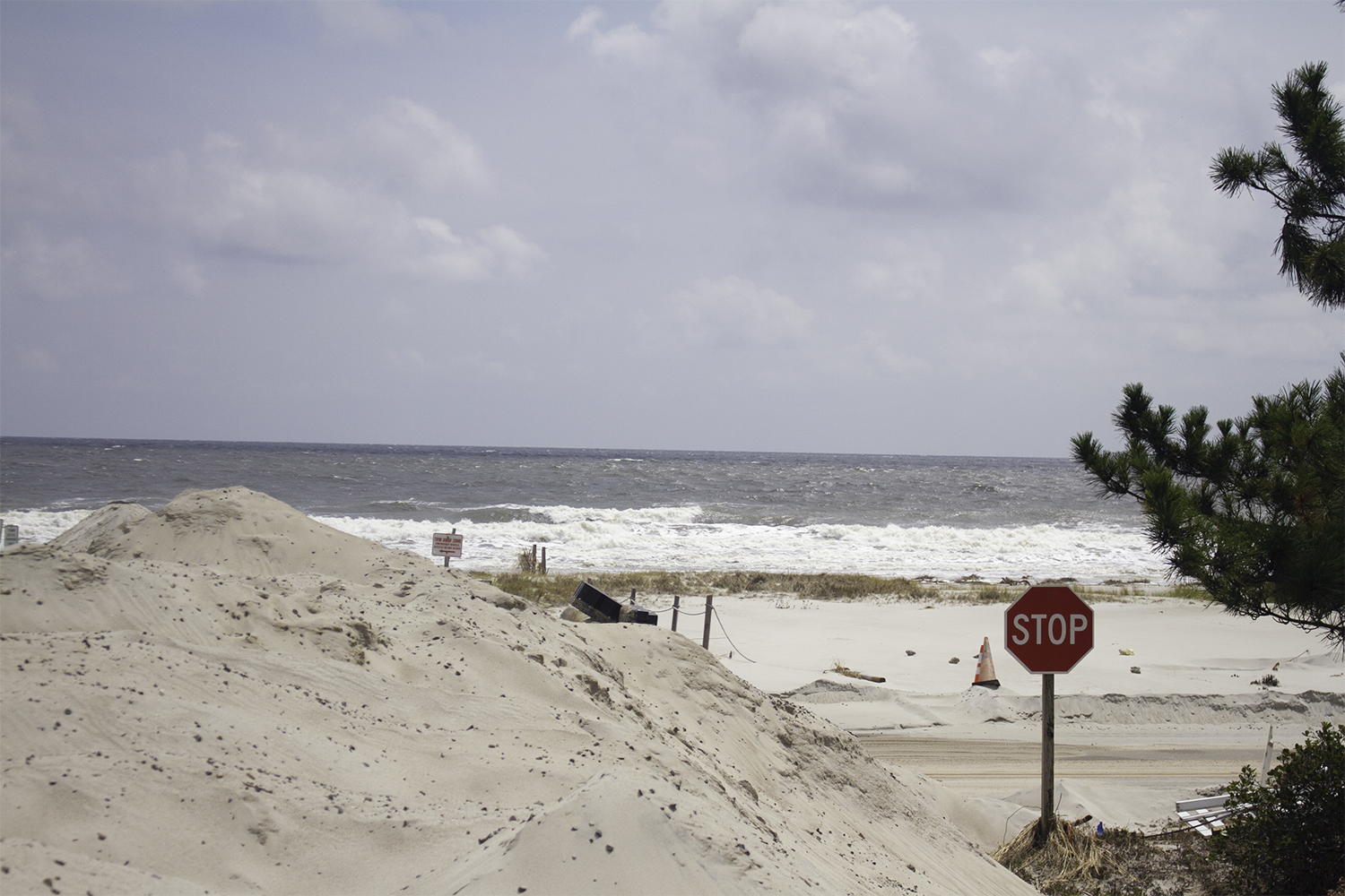 Piles of sand still block the side streets and more than half of Oak Island's public parking locations one month after Hurricane Isaias made landfall. (Port City Daily photo/Johanna F. Still)