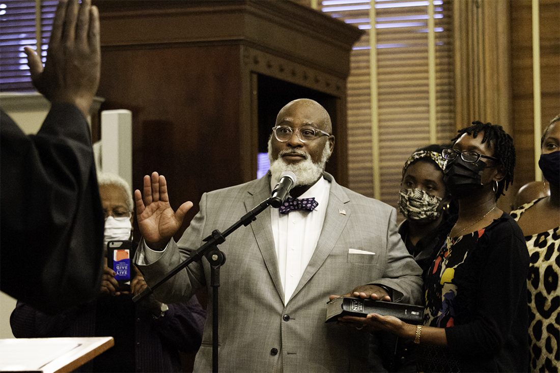 Jonathan Barfield, Jr. takes his oath of office before taking his seat to serve a fourth term on the New Hanover County Board of Commissioners. (Port City Daily photo/Johanna F. Still)