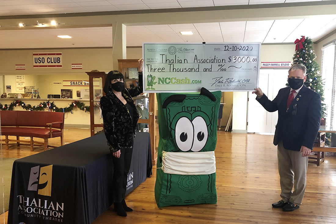 State Treasurer Dale Folwell presents Thalian Association executive director Susan Habas with a check for $3,000. (Port City Daily photo/Courtesy N.C. State Treasurer Dale Folwell)