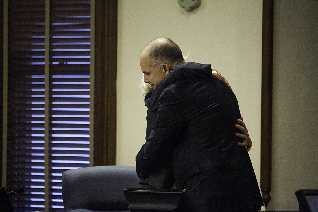New Hanover County chair Julia Olson-Boseman embraces commissioner Woody White during his last meeting on the board. (Port City Daily photo/Johanna F. Still)