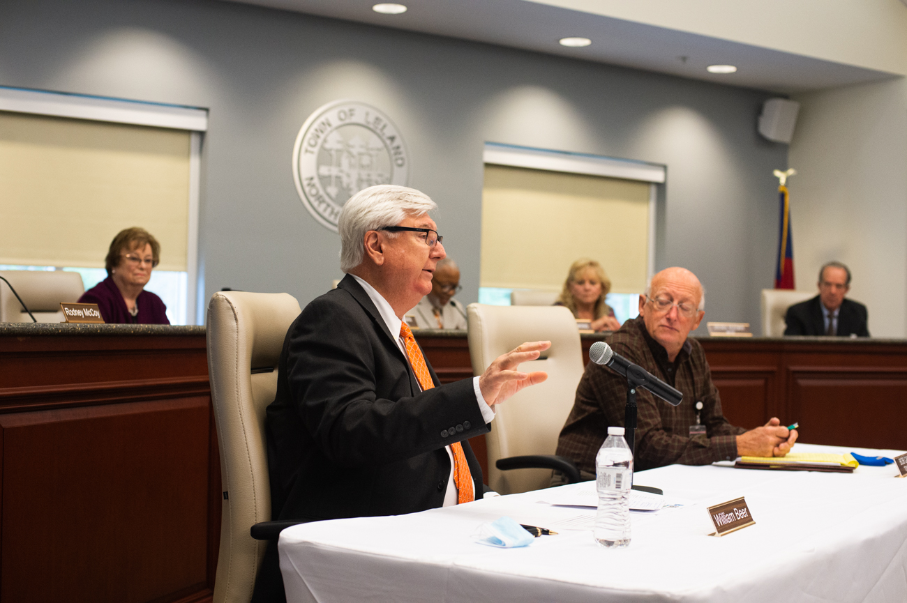 (Left) H2GO Commissioner Bill Beer speaks at a joint H2GO and Town of Leland meeting on March 19 when the two boards voted unanimously to merge utility systems. (Port City Daily photo/Mark Darrough)