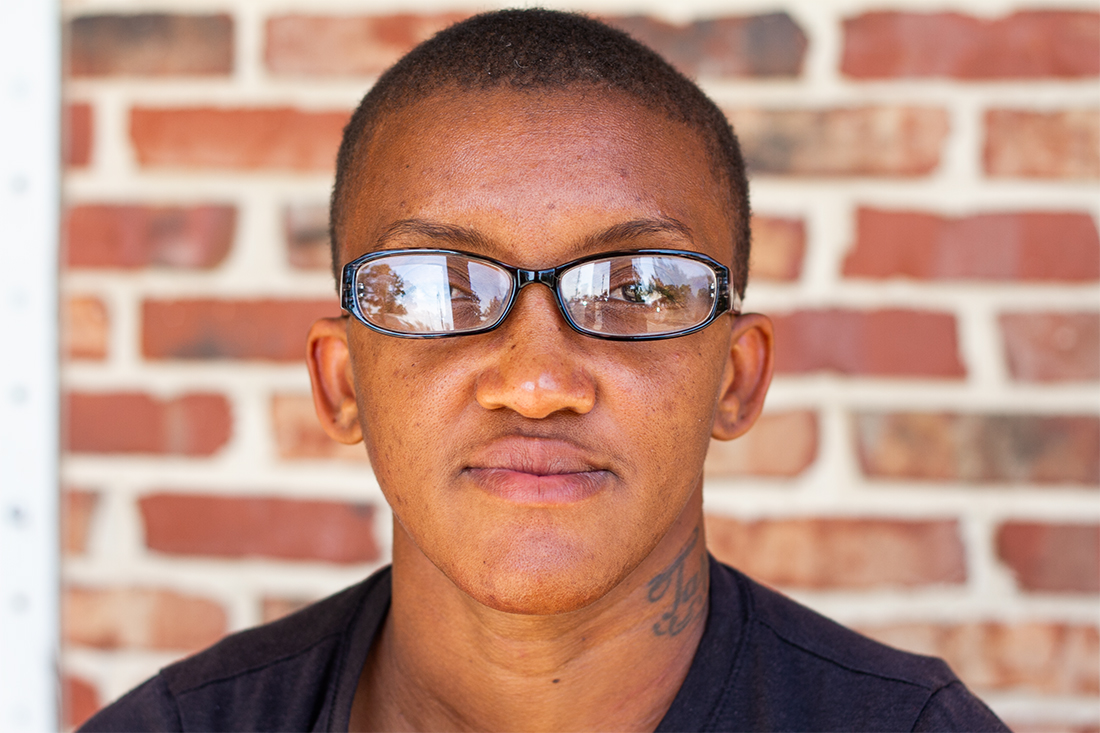 Tarsha Mills, 42, sits for a portrait in downtown Wilmington. (Port City Daily photo/Johanna F. Still)