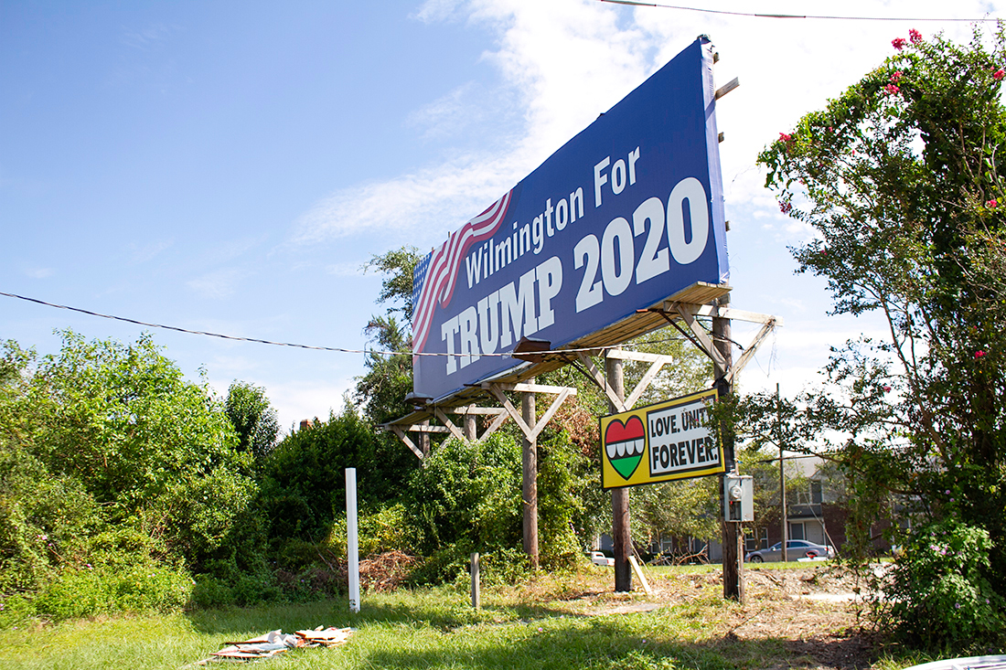 The Trump billboard, erected directly behind the Black Lives Do Matter art installation off Third Street, was vandalized in October 2020. (Port City Daily photo/Johanna F. Still)